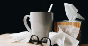 picture of a mug, glasses and kleenex, chair massage maryland