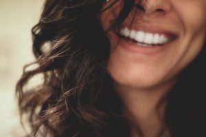 woman smiling after mobile chair massage