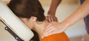 woman receiving a mobile chair massage - Corporate Massage Kneads