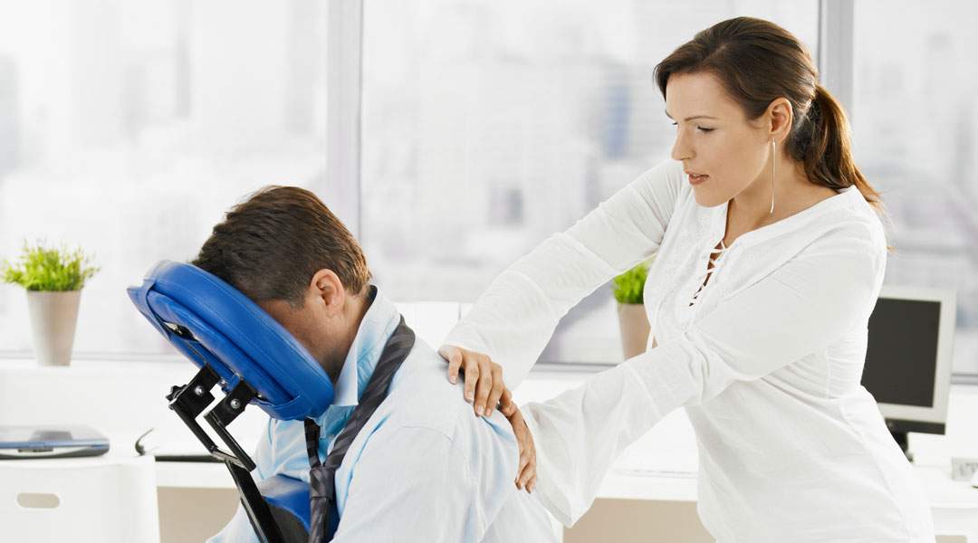 neck of a woman receiving mobile chair massage