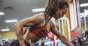 woman working out at gym - mobile chair massage maryland - Corporate Massage Kneads Maryland