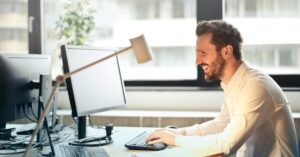 man at desk after mobile chair massage corporate maryland -Corporate Massage Kneads Maryland